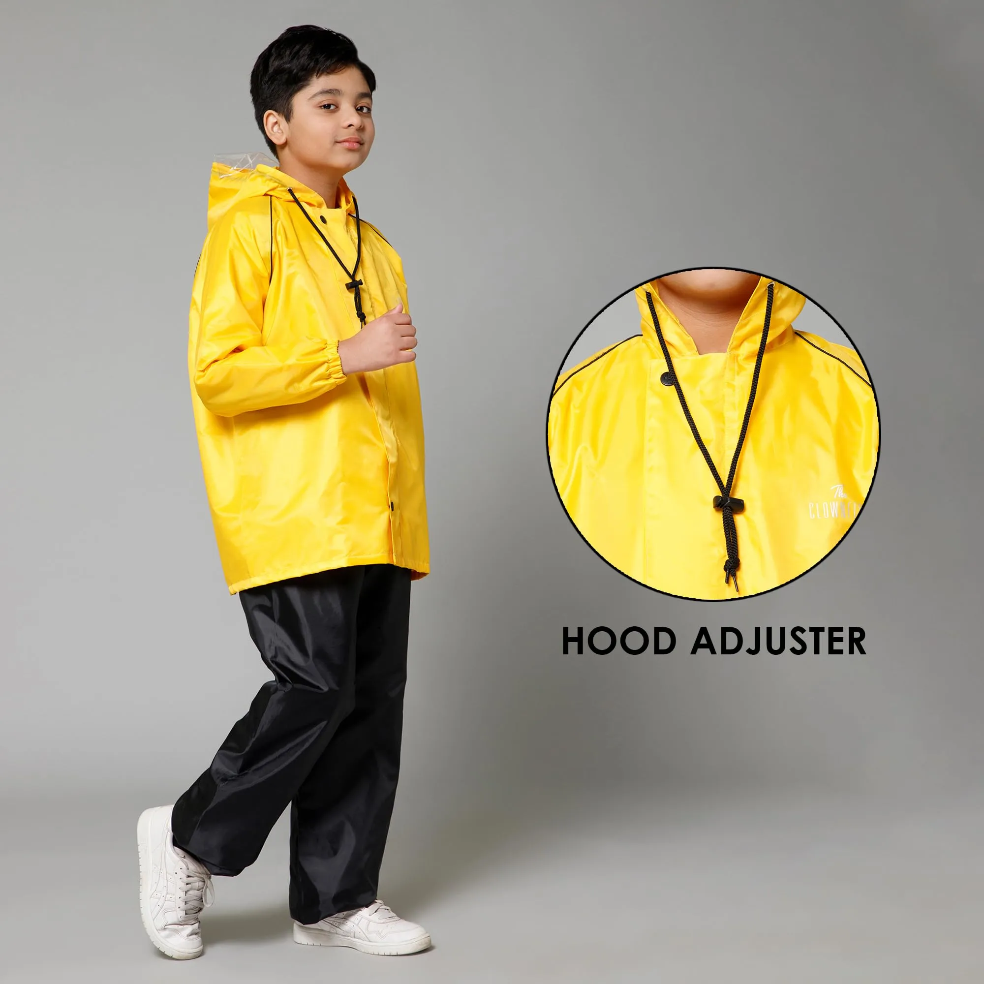 THE CLOWNFISH Duke Series Kids Waterproof Polyester Double Coating Reversible Raincoat with Hood and Reflector Logo at Back. Set of Top and Bottom. Printed Plastic Pouch. Kid Age-8-10 years (Yellow)