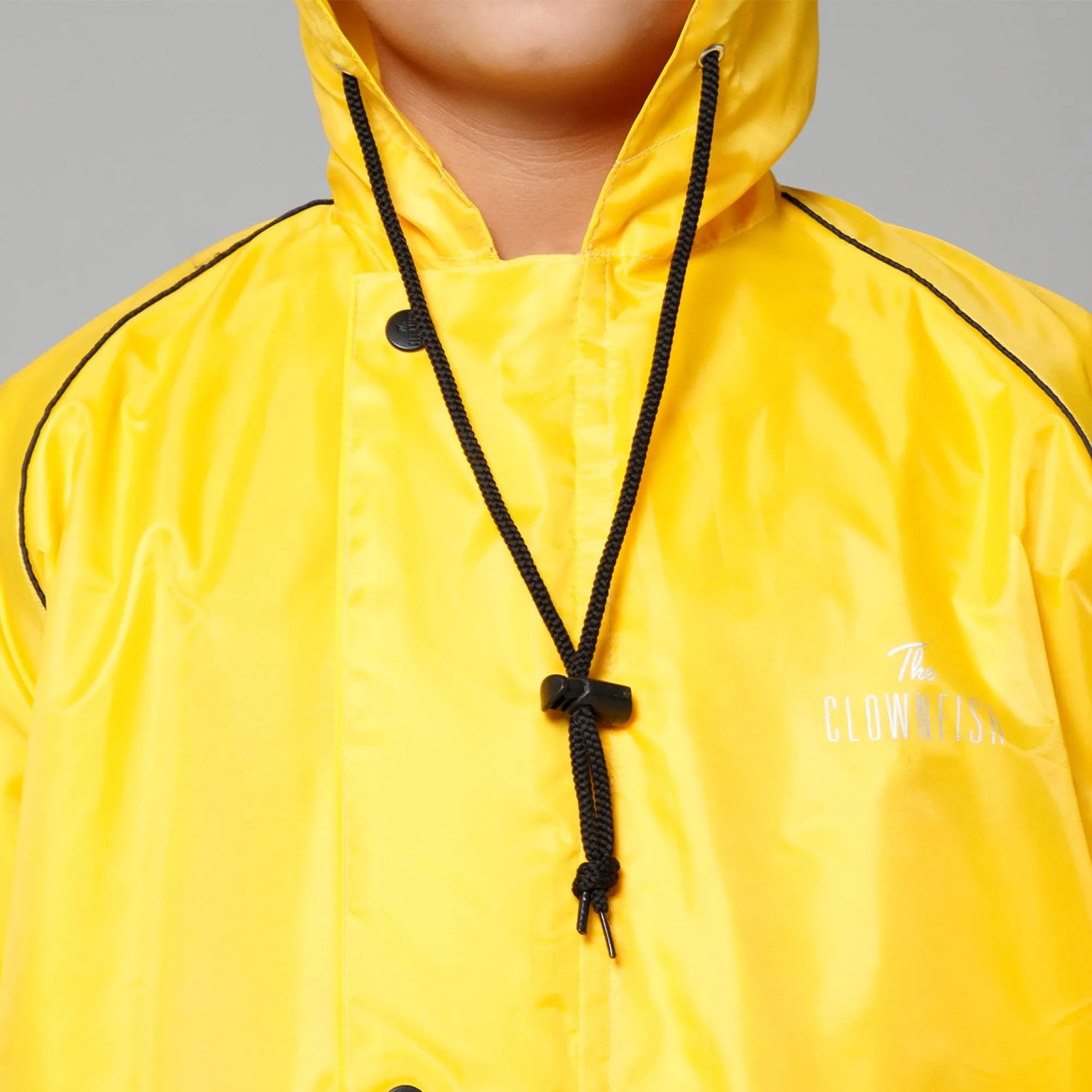 THE CLOWNFISH Duke Series Kids Waterproof Polyester Double Coating Reversible Raincoat with Hood and Reflector Logo at Back. Set of Top and Bottom. Printed Plastic Pouch. Kid Age-8-10 years (Yellow)