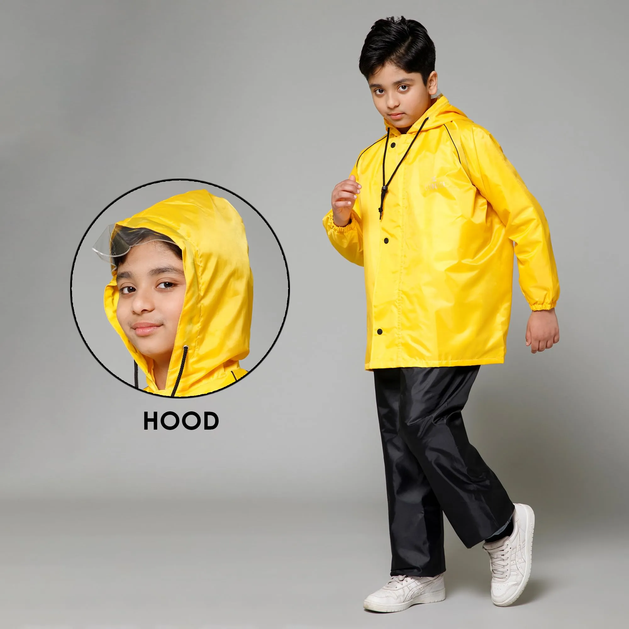 THE CLOWNFISH Duke Series Kids Waterproof Polyester Double Coating Reversible Raincoat with Hood and Reflector Logo at Back. Set of Top and Bottom. Printed Plastic Pouch. Kid Age-8-10 years (Yellow)