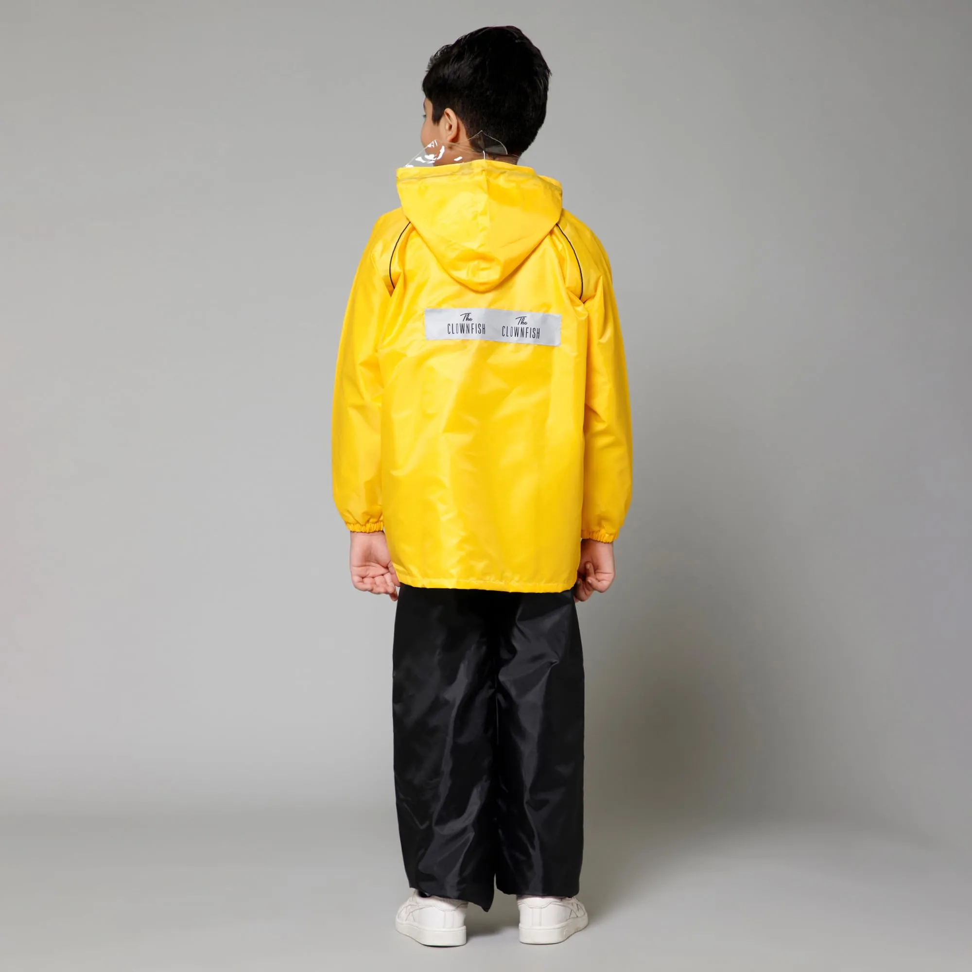 THE CLOWNFISH Duke Series Kids Waterproof Polyester Double Coating Reversible Raincoat with Hood and Reflector Logo at Back. Set of Top and Bottom. Printed Plastic Pouch. Kid Age-8-10 years (Yellow)